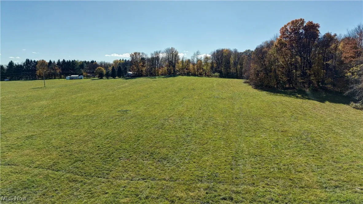 View of grassy yard with a rural view