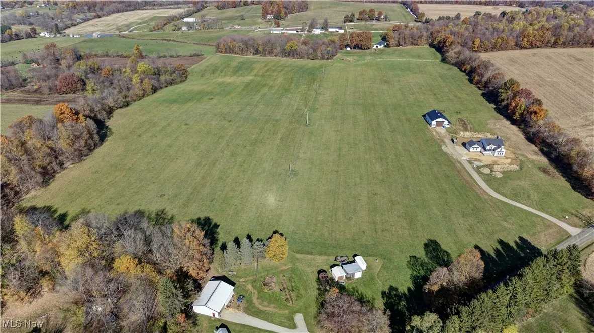 Aerial view of property and surrounding area with rural landscape