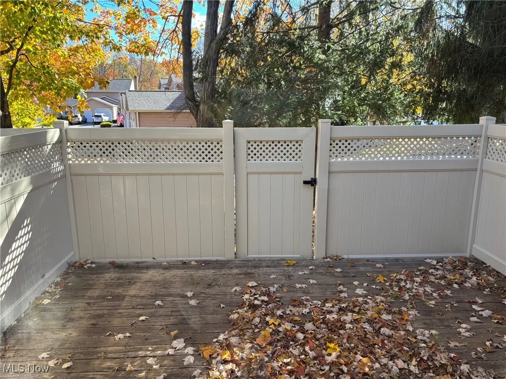 Enclosed patio deck and view of gate