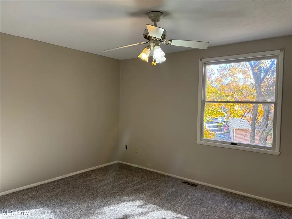 Bedroom 2  with carpet and a ceiling fan