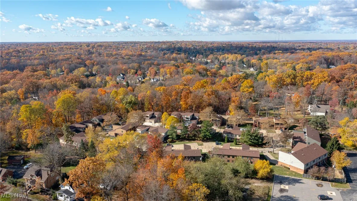 Aerial overview of property's location with nearby suburban area