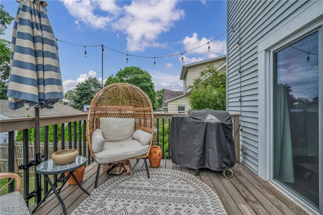 Wooden terrace featuring area for grilling