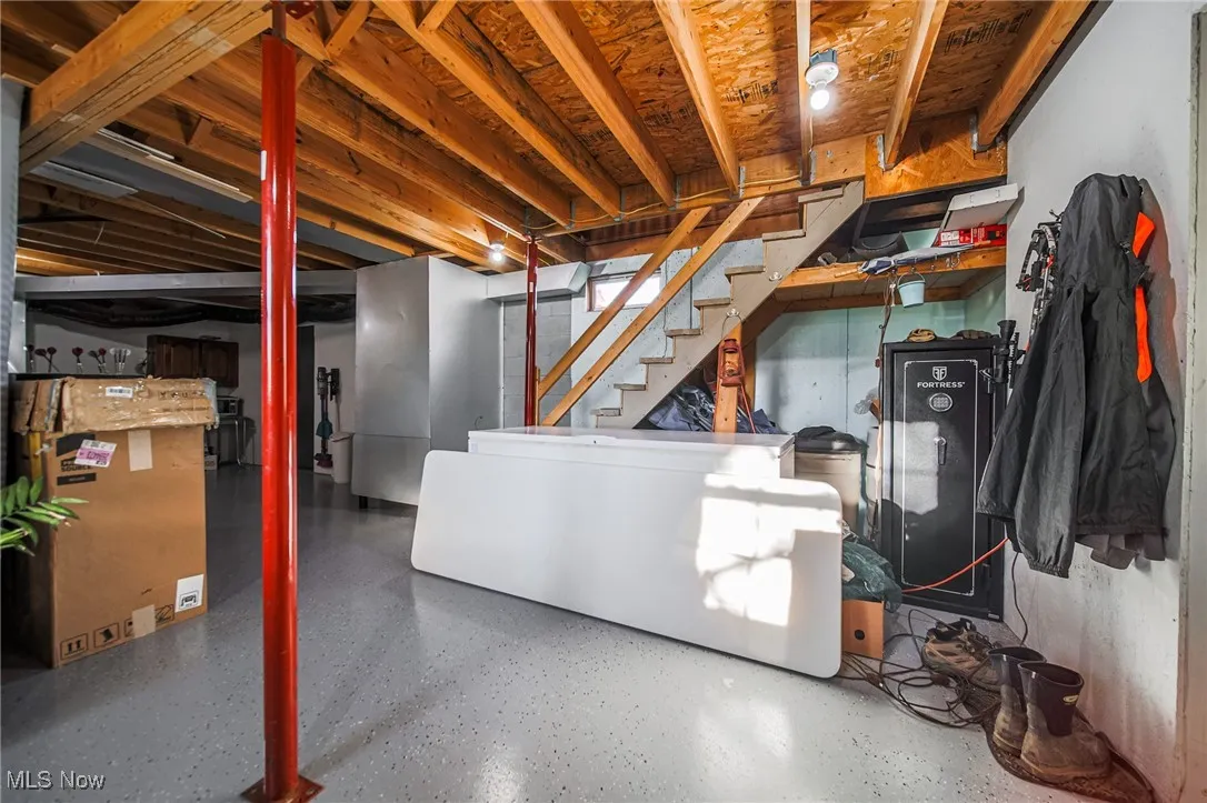 Unfinished basement featuring stairs