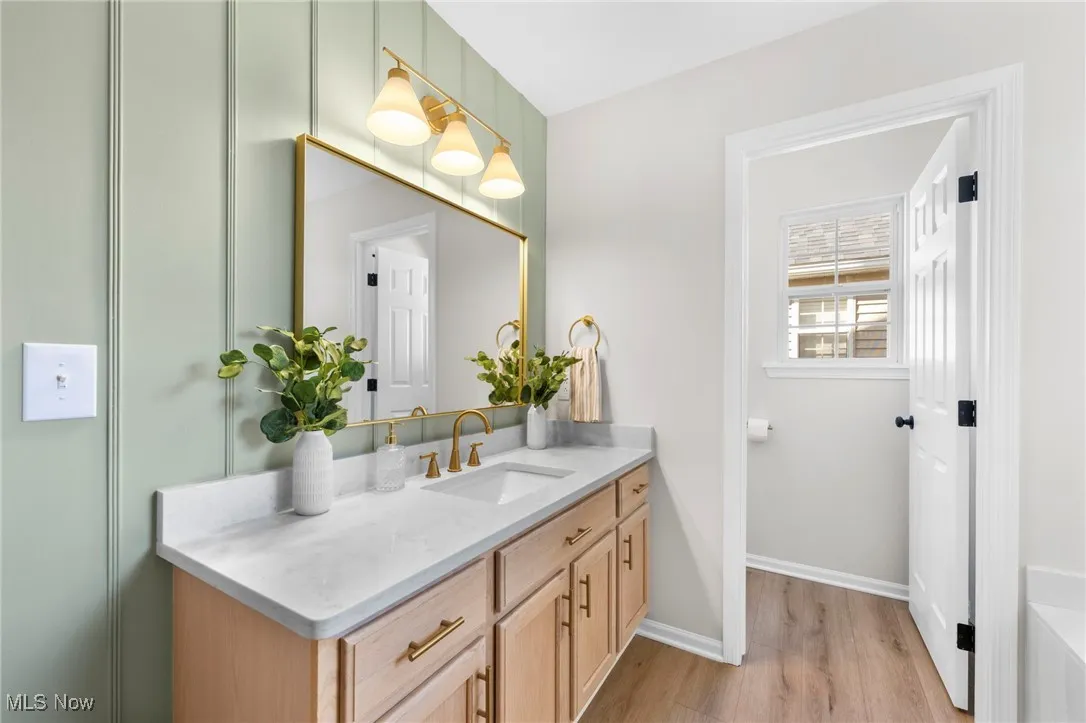 Bathroom featuring vanity and light wood-style flooring