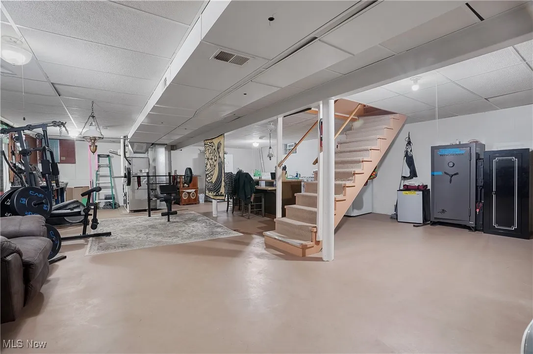 Workout area featuring a paneled ceiling