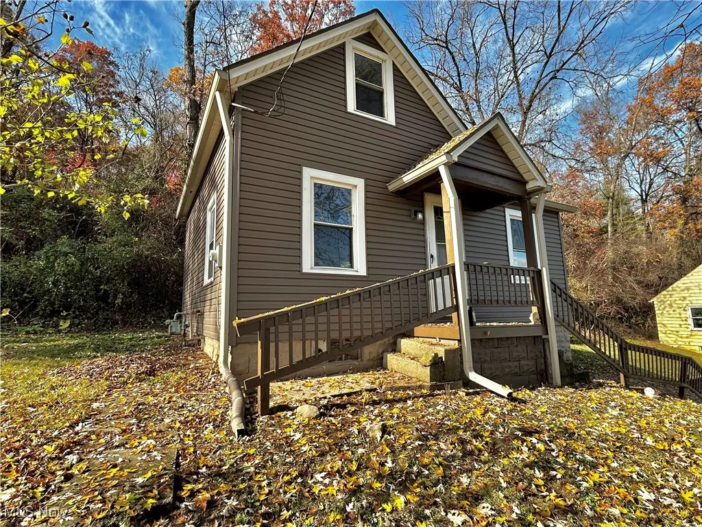 View of front of house featuring stairs