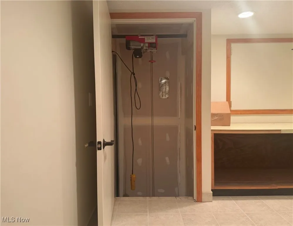 Bathroom featuring tile patterned flooring and vanity