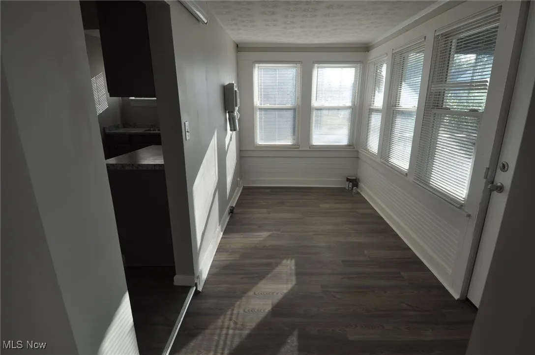 Laundry room with vinyl/LVT flooring. W/D hookups and dryer vent, plus front outside entrance