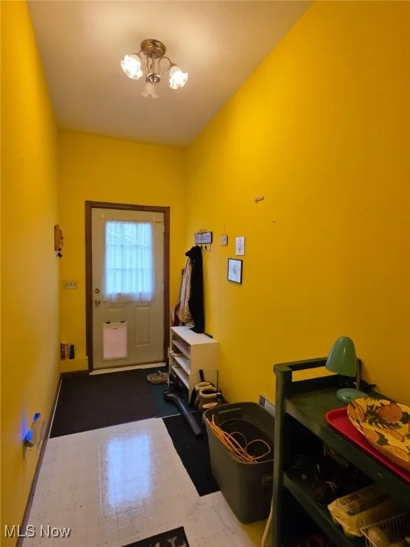 Mudroom just off the side of the house from the garage.