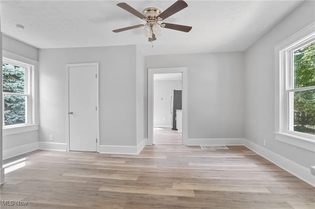 Unfurnished bedroom featuring light wood-style flooring and a ceiling fan