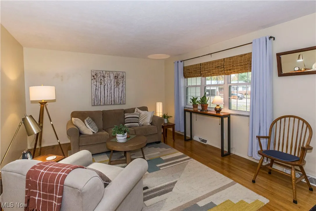 Living room with wood finished floors and baseboards