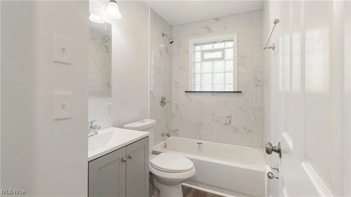 Bathroom featuring vanity and bathtub / shower combination