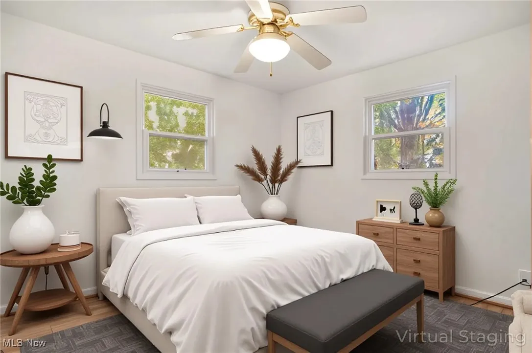 Bedroom with wood finished floors and a ceiling fan