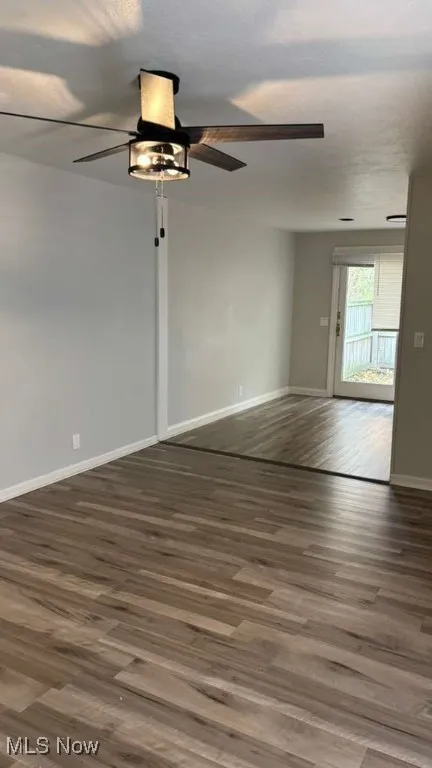 Spare room featuring wood finished floors and ceiling fan