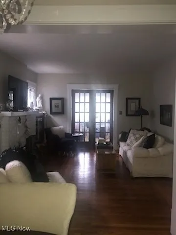 Living room featuring healthy amount of natural light and wood  floors