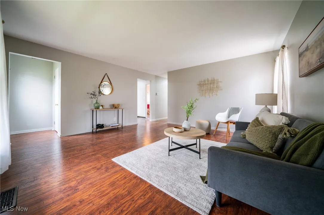 Living room featuring wood finished floors and baseboards