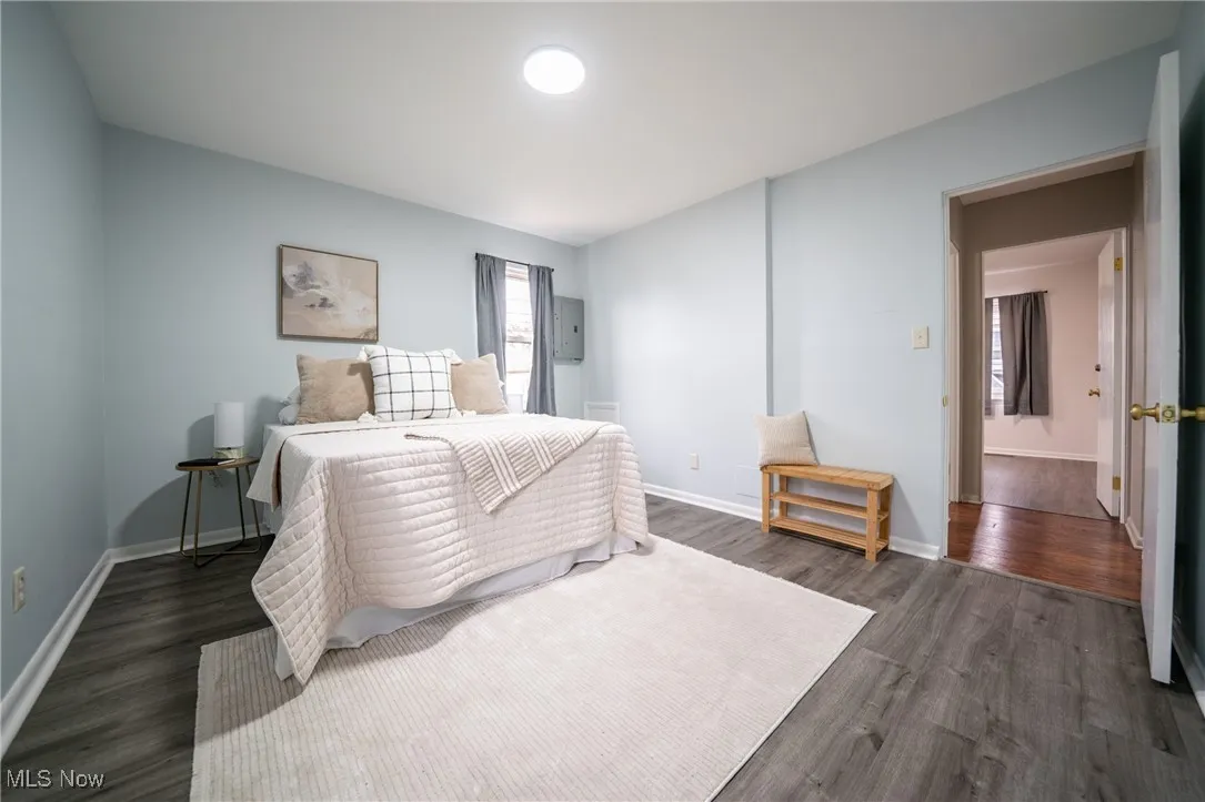 Bedroom featuring dark wood-type flooring
