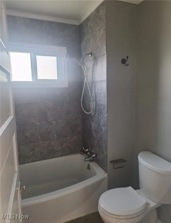 Bathroom with  shower combination and crown molding