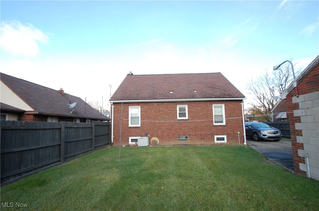 Back of property with brick siding
