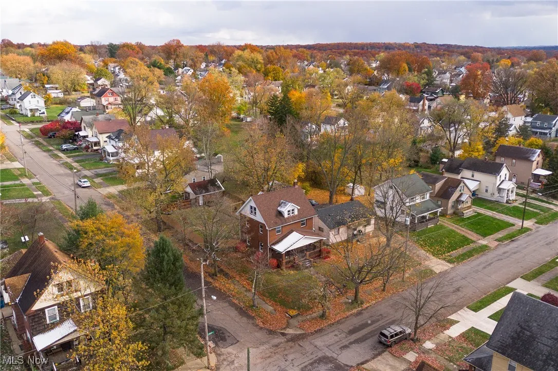 Aerial overview of property's location featuring nearby suburban area