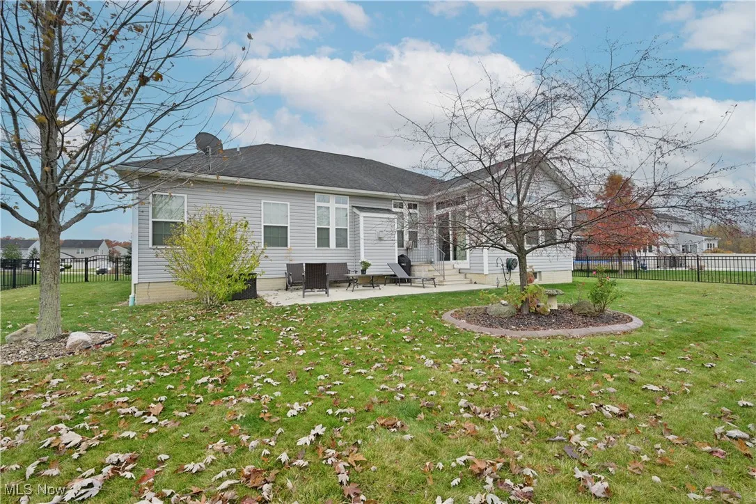 Rear view of house featuring a patio area and entry steps