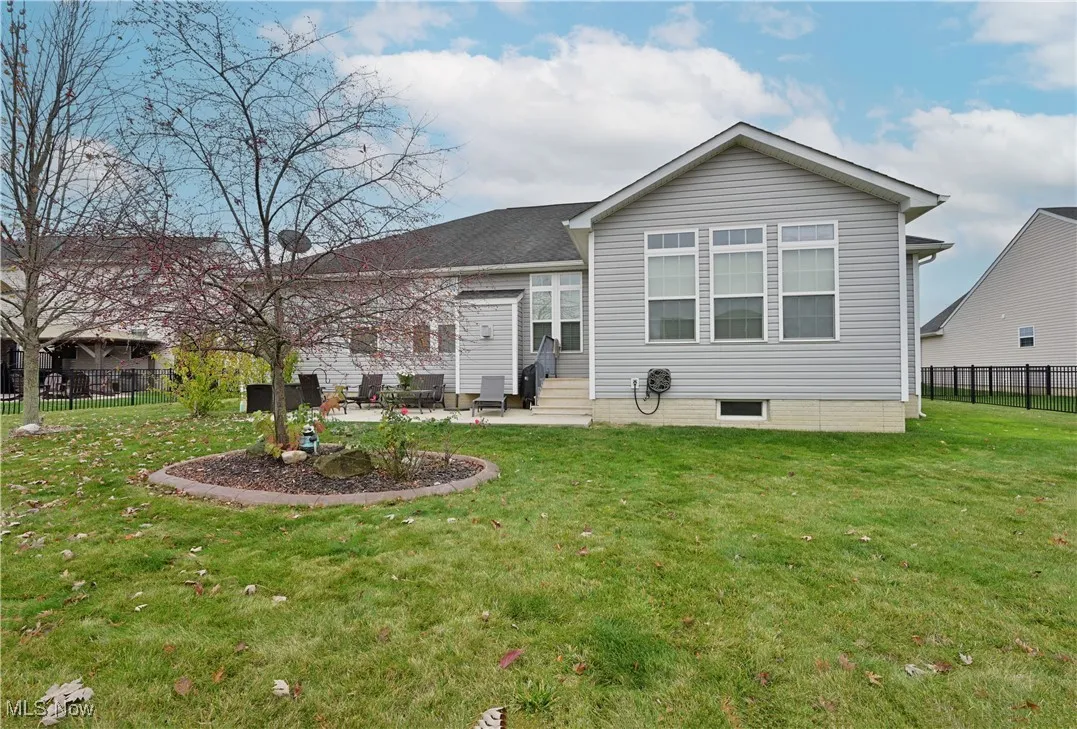 Back of property with a patio area and entry steps