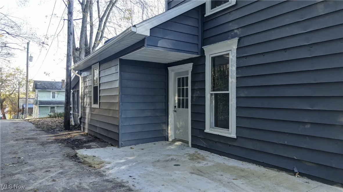 Doorway to property with a patio