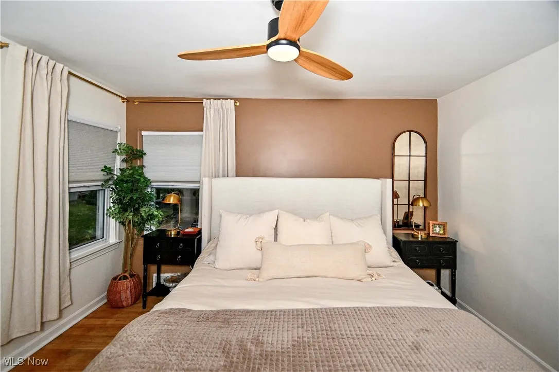 Bedroom featuring ceiling fan and wood finished floors