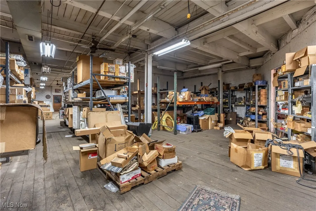 Misc room with a workshop area and hardwood / wood-style flooring