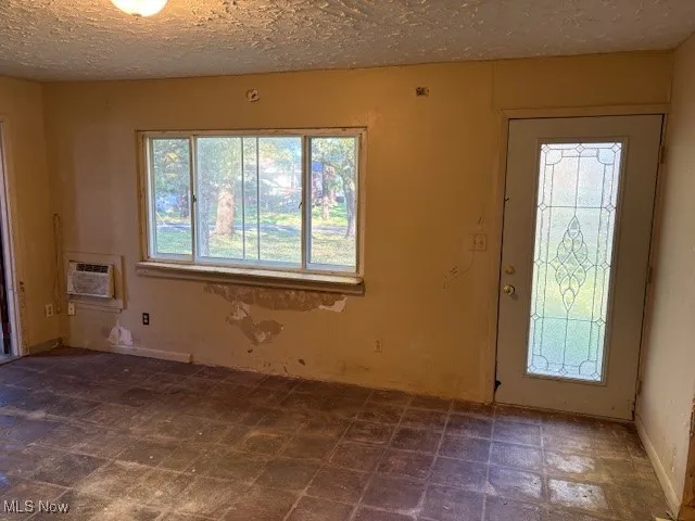 Living room with lead glass front door and picture window