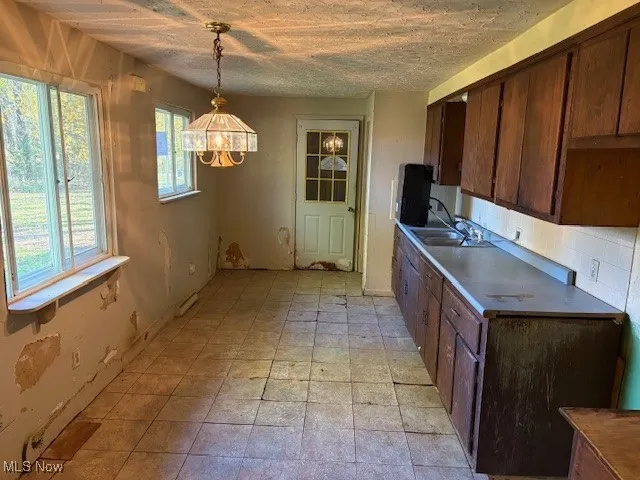 Kitchen with brown cabinetry