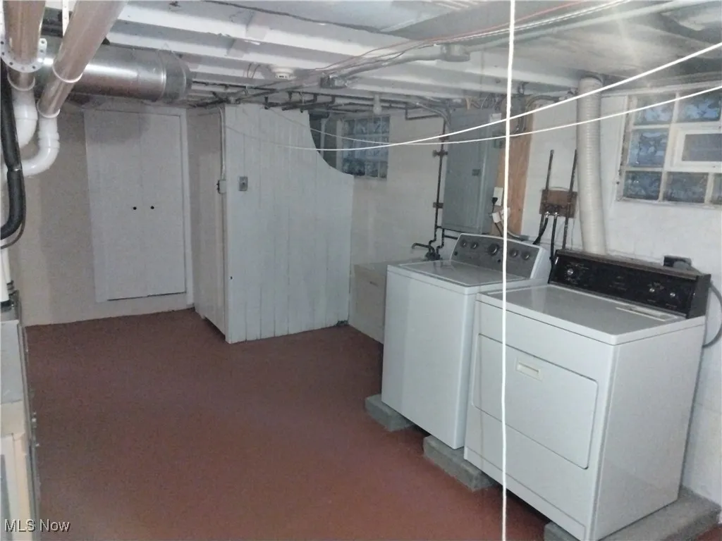 Washroom featuring washer and clothes dryer
