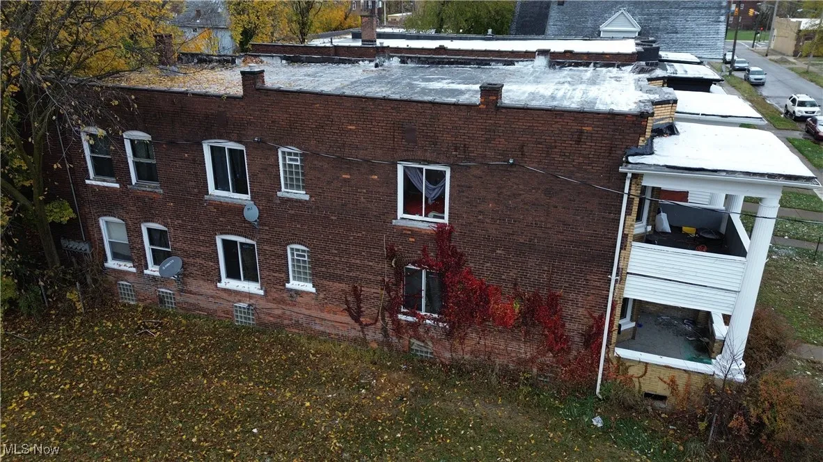 View of home's exterior with brick siding and crawl space