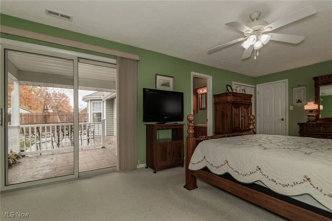 This primary suite has a slider out to the covered private rear patio!
