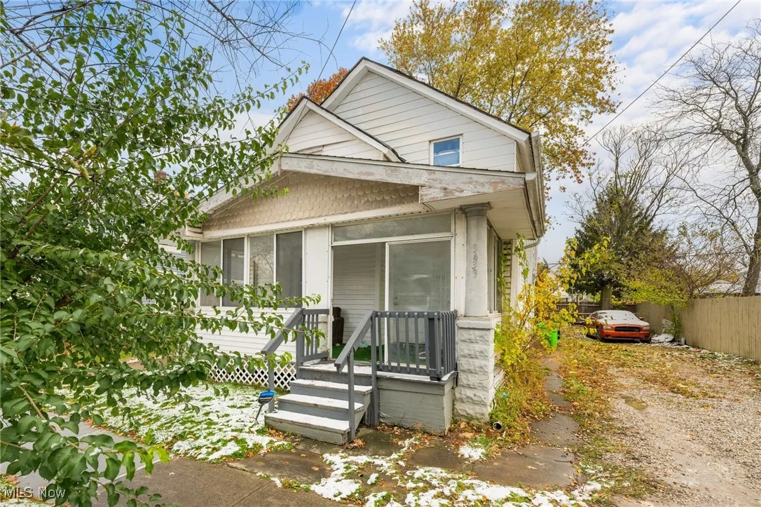 View of front facade with a sunroom