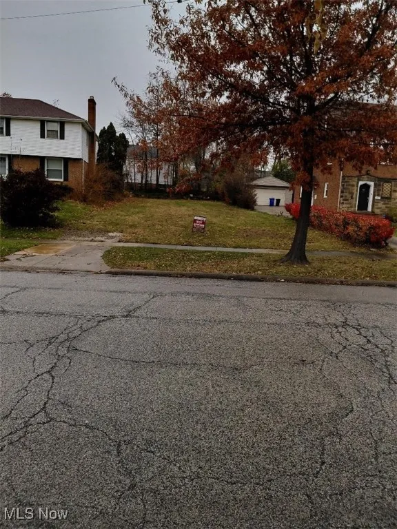 View of asphalt road with sidewalks and curbs