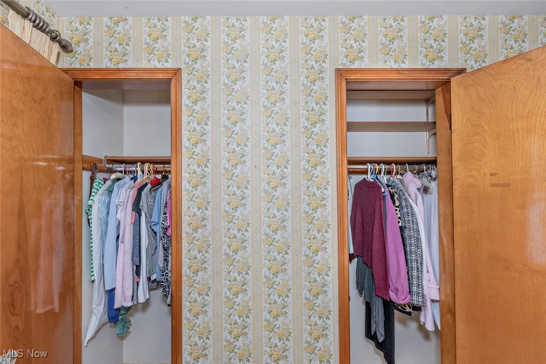 View of closet in primary bedroom