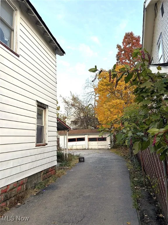 View of side of home featuring a garage