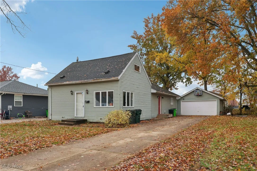 View of front of property with 2 car detached garage