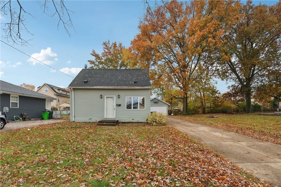 Front of property with a driveway and 2 car detached garage