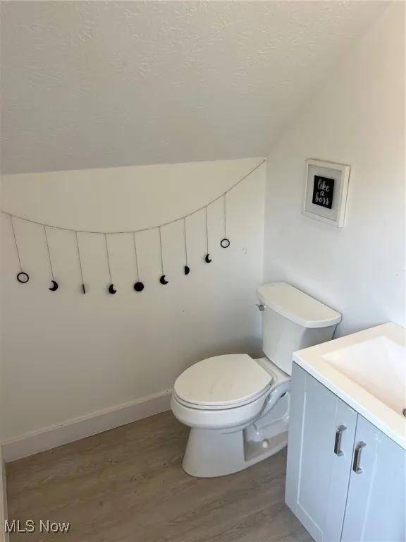 Convenient half bath in upstairs workshop of garage.
