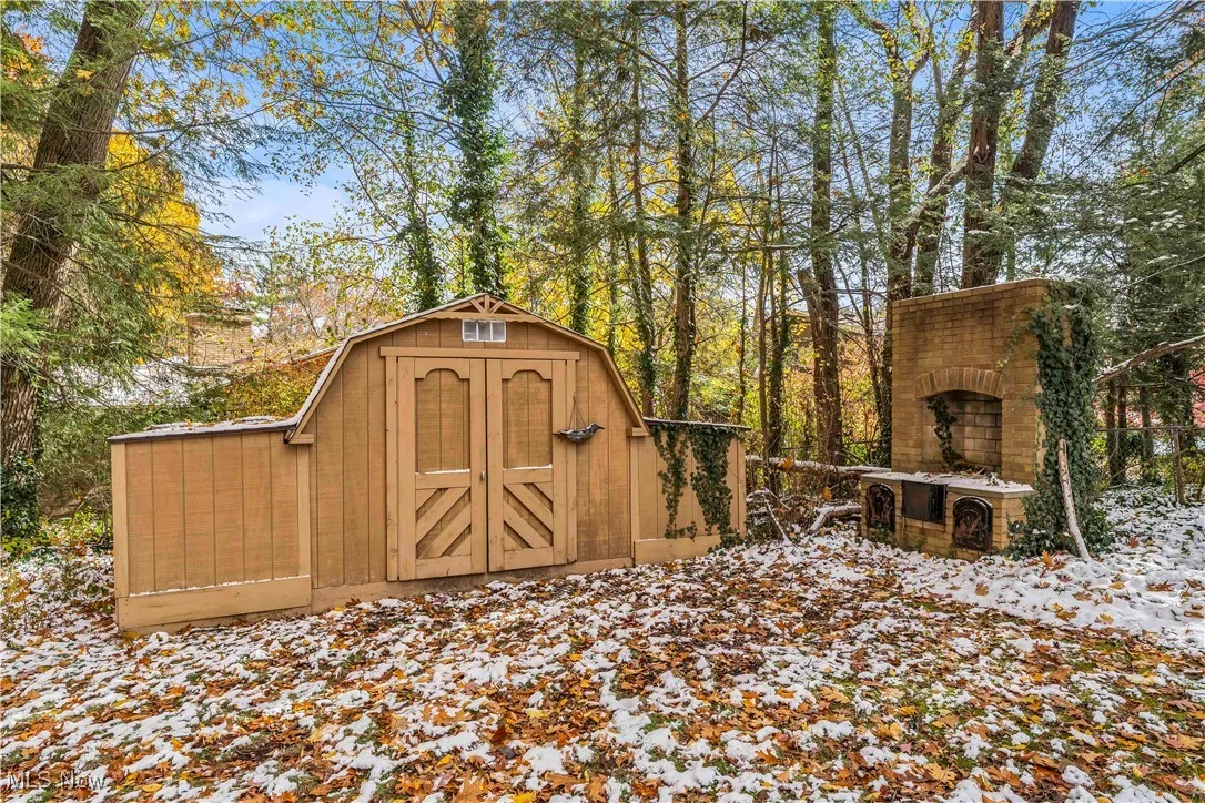 Snow covered structure with a storage unit