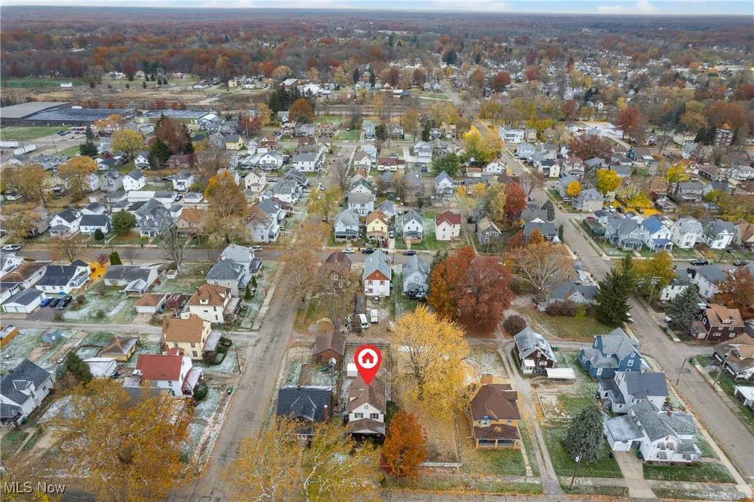 Aerial view of property's location featuring nearby suburban area