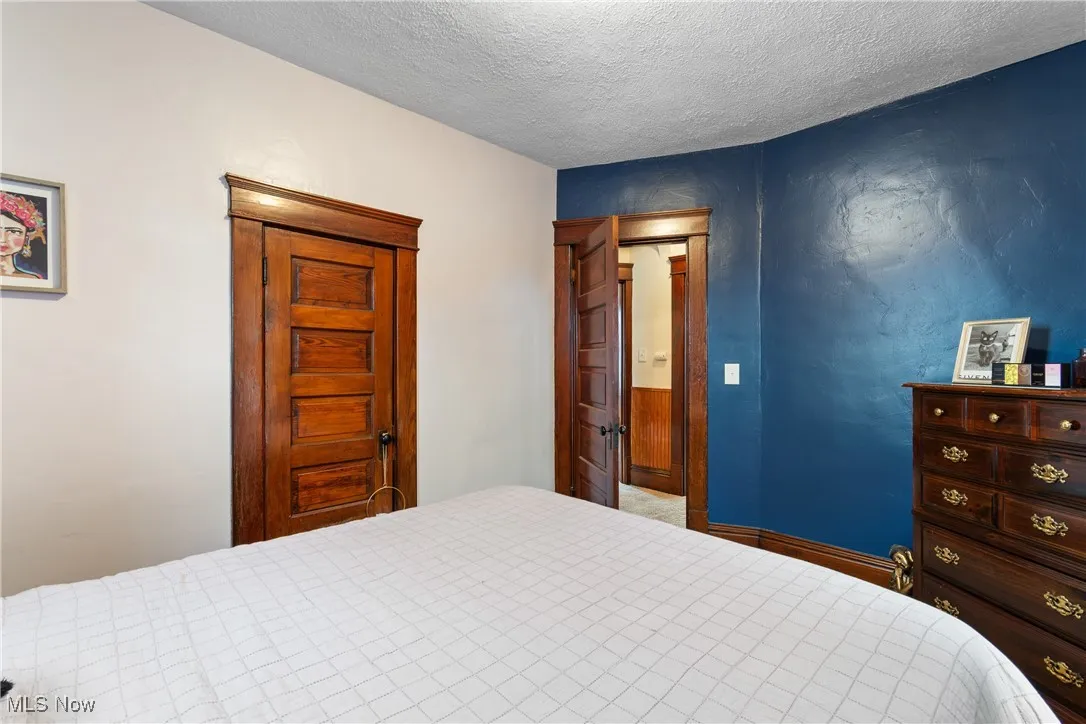 Bedroom featuring a textured ceiling