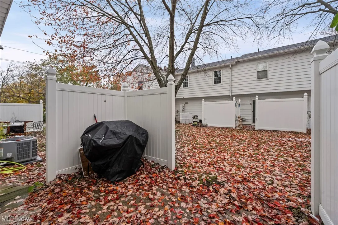 View of side of property featuring a central AC unit