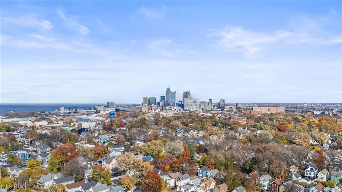 Aerial view of property's location featuring city skyline