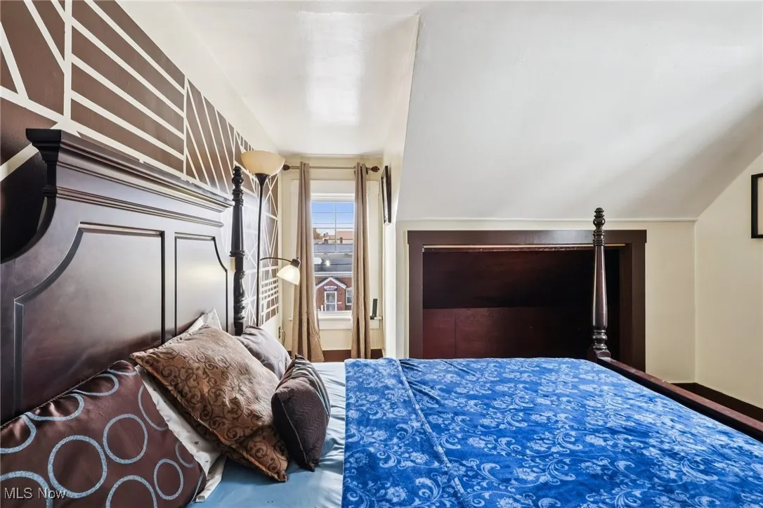 Bedroom with vaulted ceiling