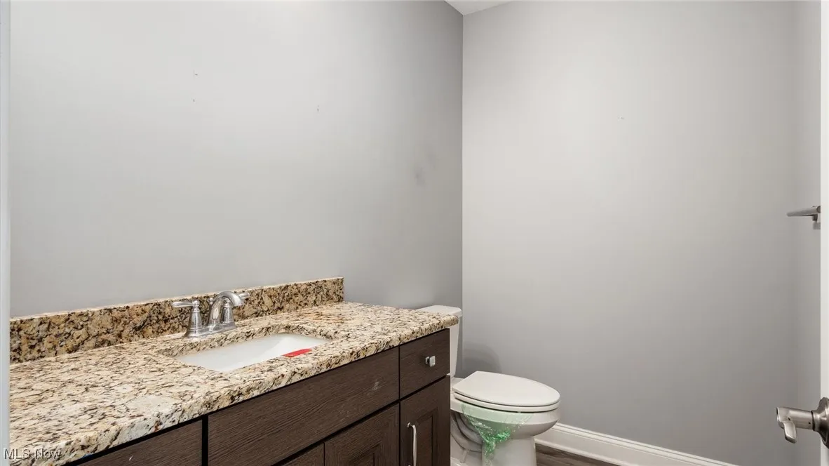 Bathroom featuring vanity and baseboards