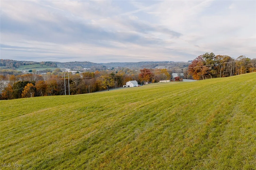 View of mountain backdrop with rural landscape