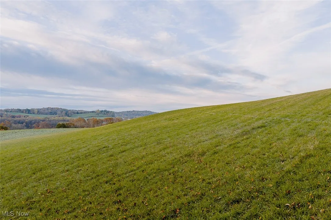 View of green lawn featuring a view of countryside